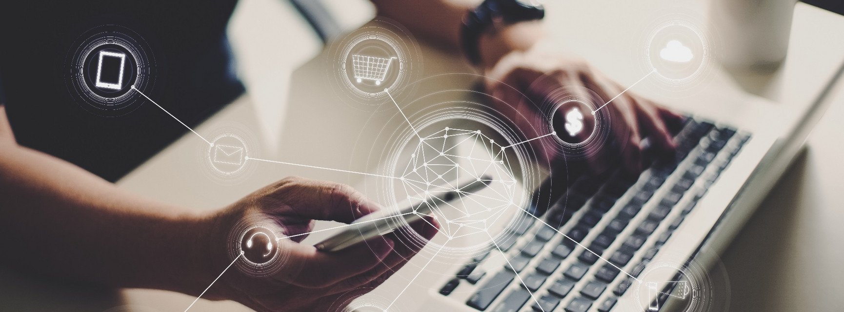 Person with mobile phone and laptop