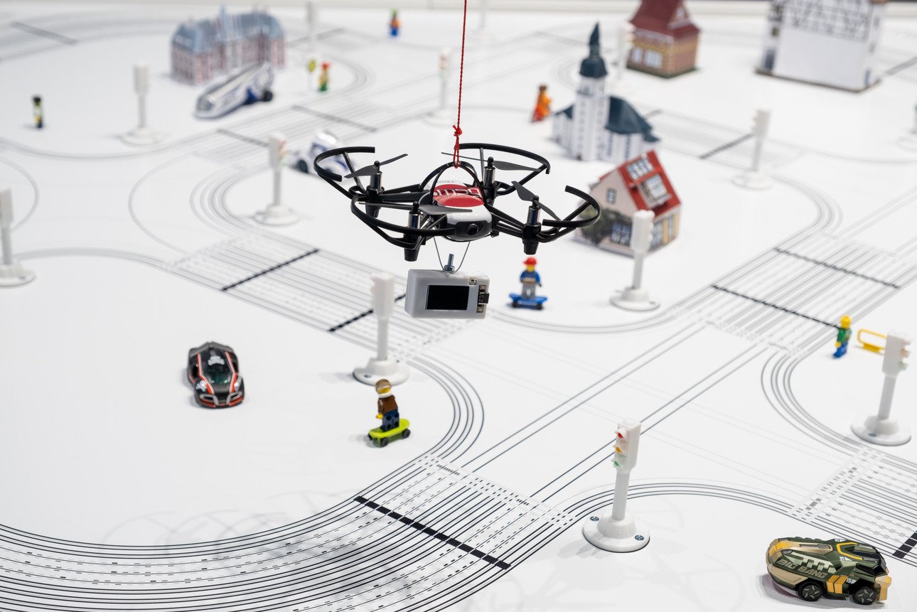  A drone flies over a model landscape.